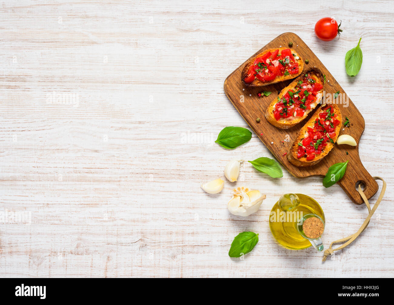 Italian Cuisine Food Bruschetta Antipasto with Basil and Tomato in Copy Space Top View Stock Photo