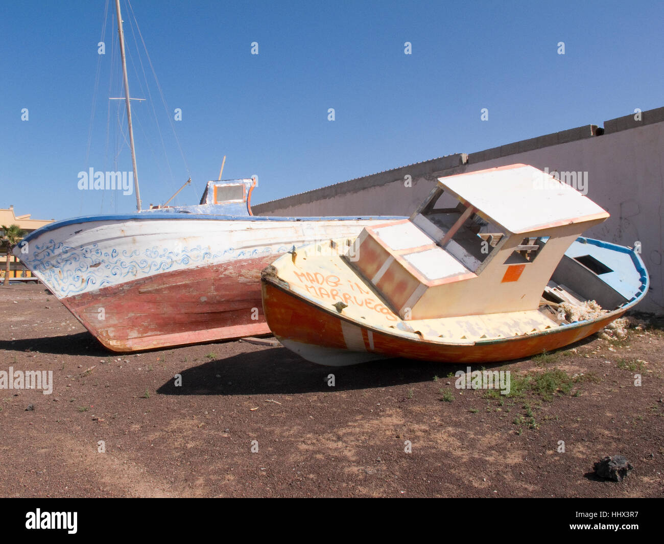 Two beached boats at Corralejo,  Fuerteventura, Canary Islands. Stock Photo