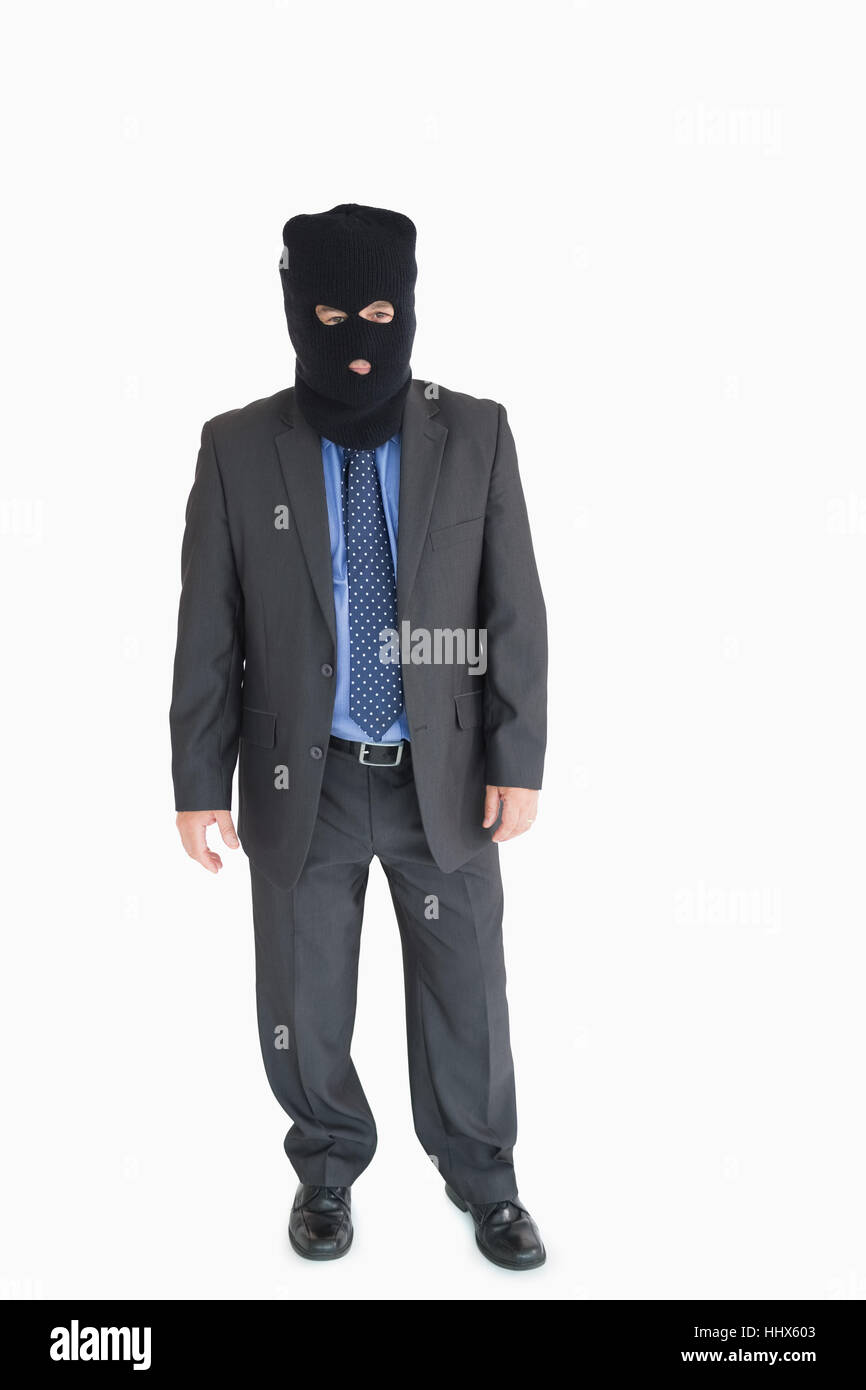 Businessman wearing a balaclava like a thief Stock Photo Alamy