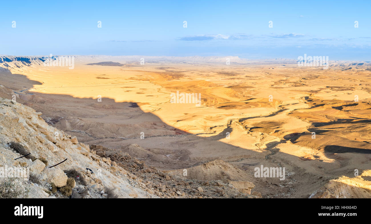 Sunset at Ramon Crater (Makhtesh) in Israel's Negev Desert from the Mizpe Ramon lookout, with Mount Ramon in the background Stock Photo