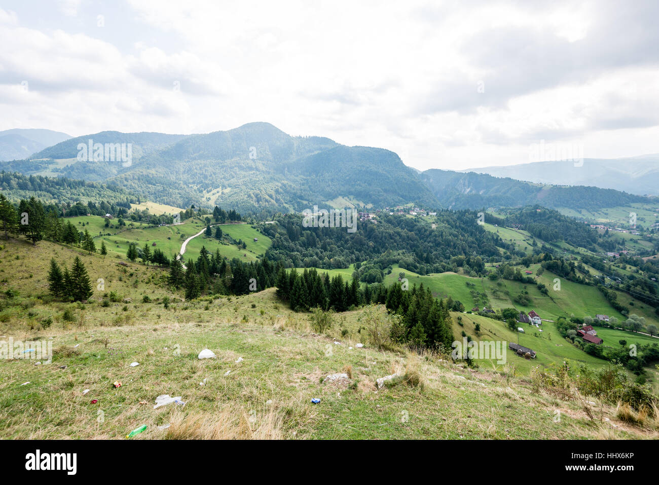 View to the carpathian mountains and romanian village from the top with ...