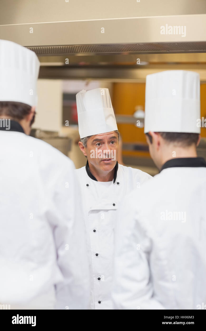 Head chef scolding employees in the kitchen Stock Photo Alamy