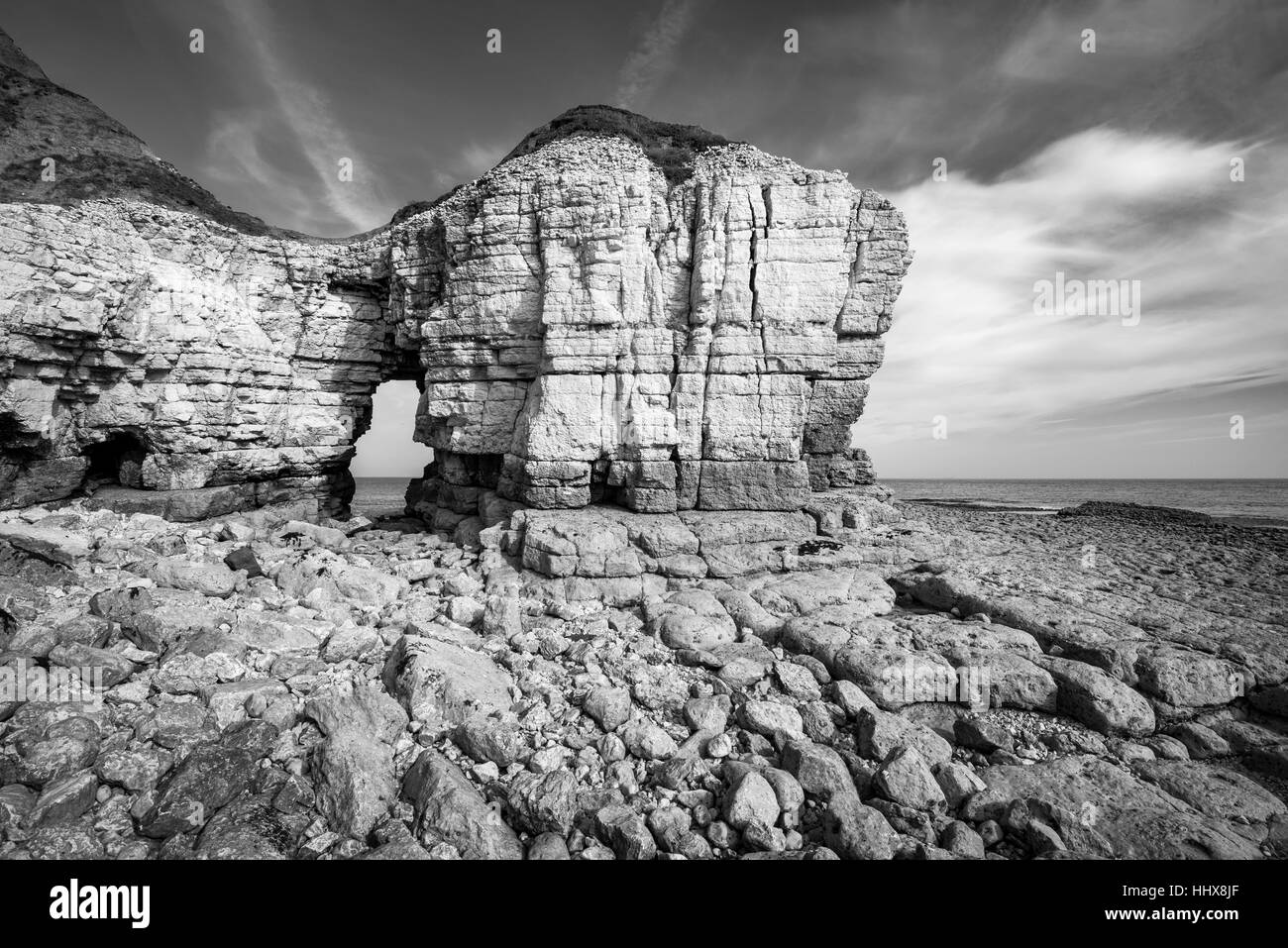 Rock arch at Thornwick bay on the coast of North Yorkshire. Stock Photo