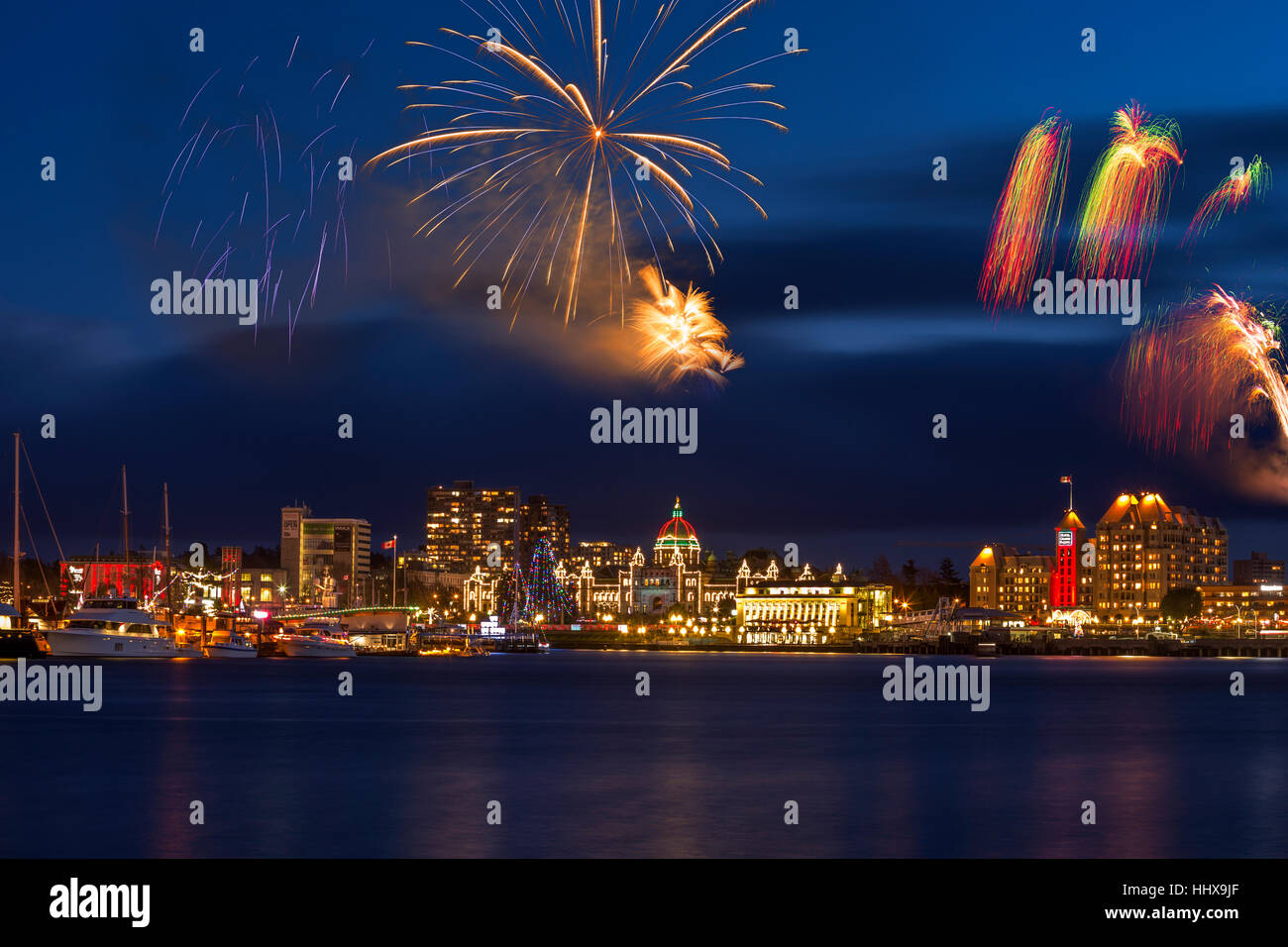 Canada's 150 Year birthday celebration fireworks on New Year's Eve2016-Victoria, British Columbia, Canada. Note-digital composite. Stock Photo