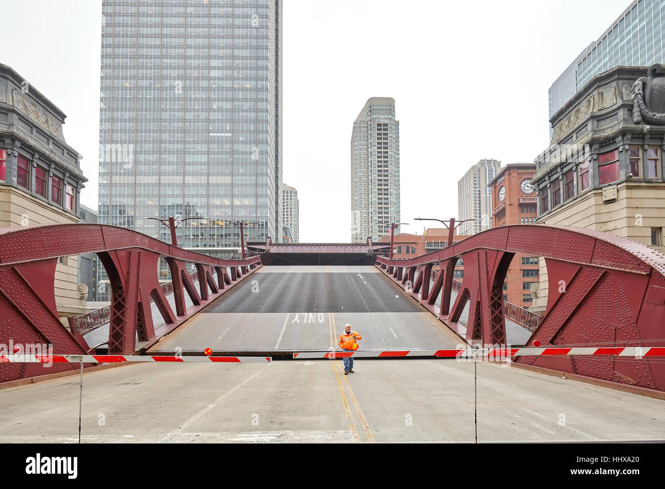 Chicago, USA - October 15, 2016: An unidentified man supervising the opening of movable bridge. Stock Photo