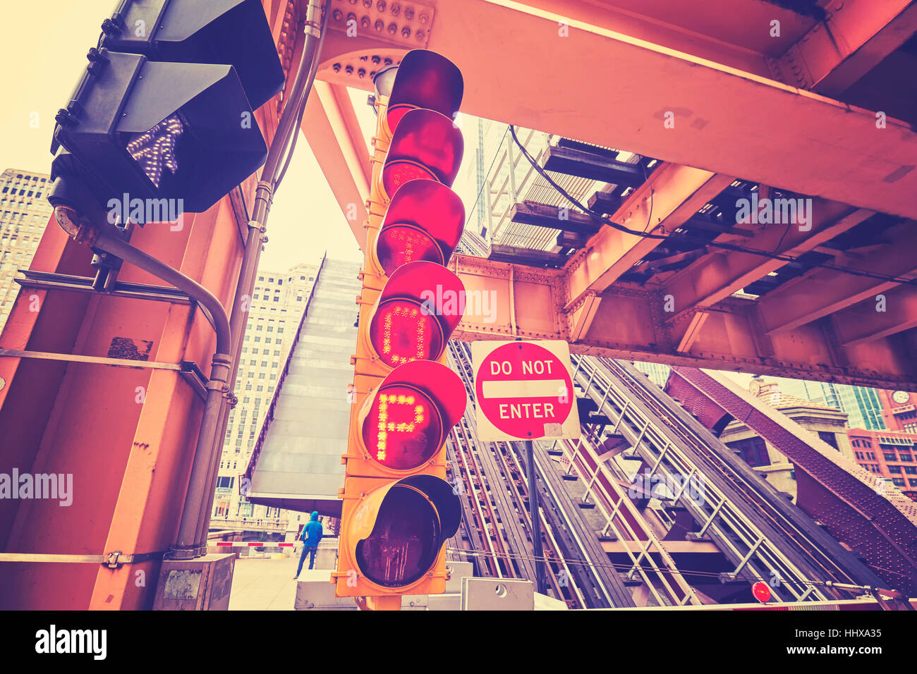 Color toned traffic lights under a movable bridge in Chicago. Stock Photo