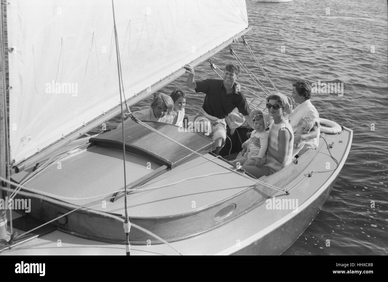 John F. Kennedy sailing on the Victura with Jackie (in striped top) and ...