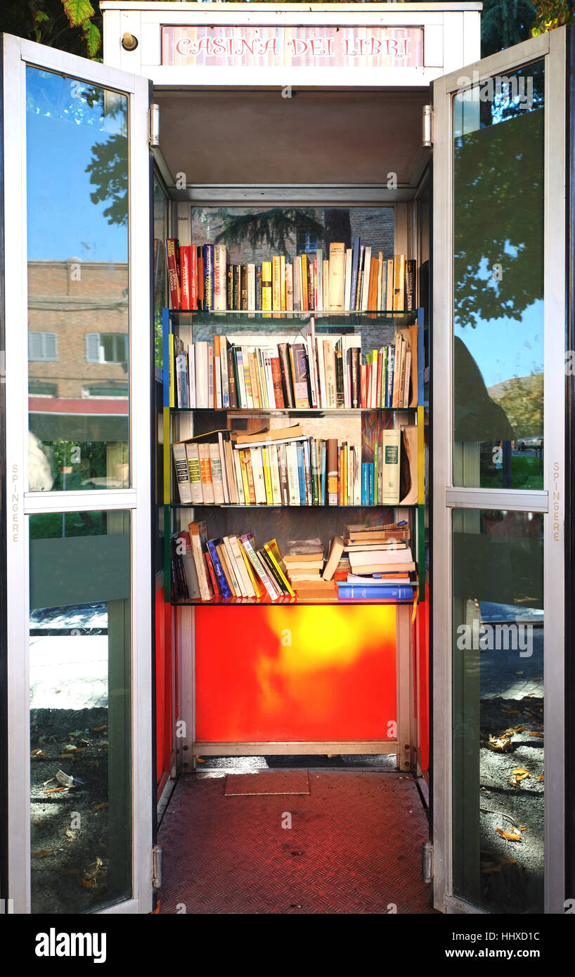 Telephone box converted to a book exchange,Citta della Pieve,Umbria,Italy Stock Photo