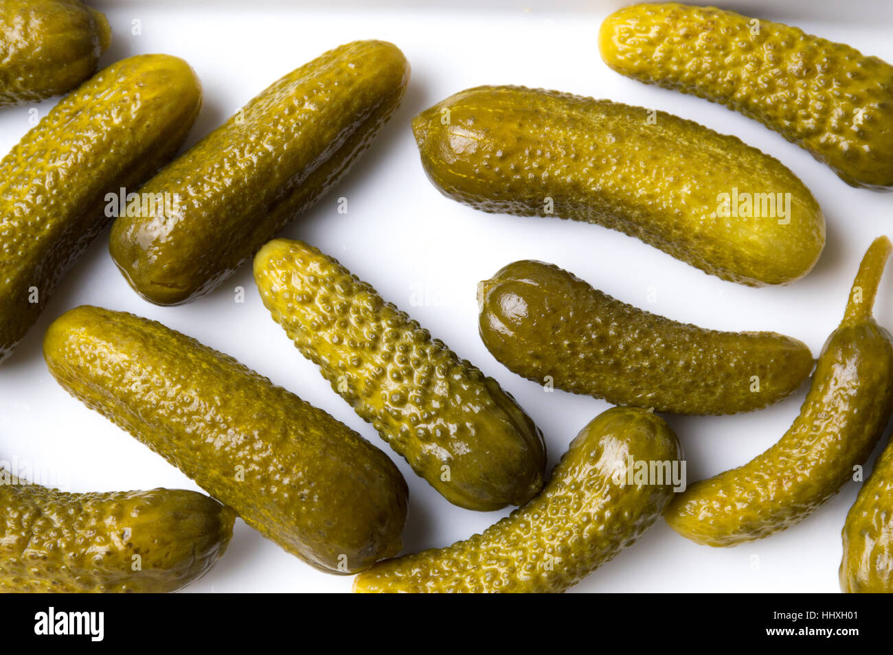 Bunch of pickled cucumbers on white background Stock Photo
