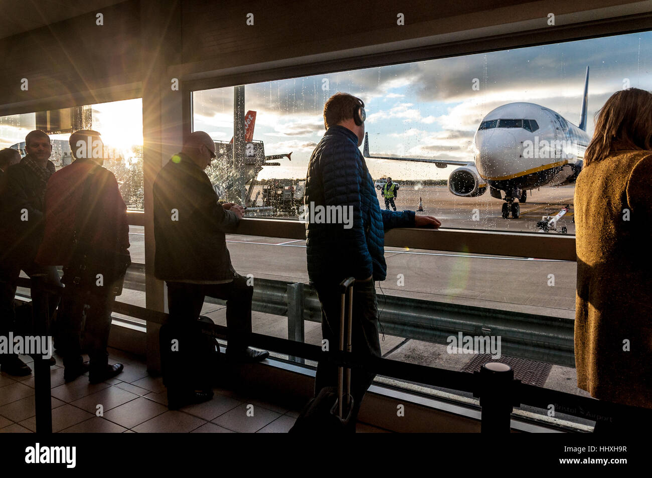 Passengers waiting to board aircraft at Bristol Airport, England, UK Stock Photo