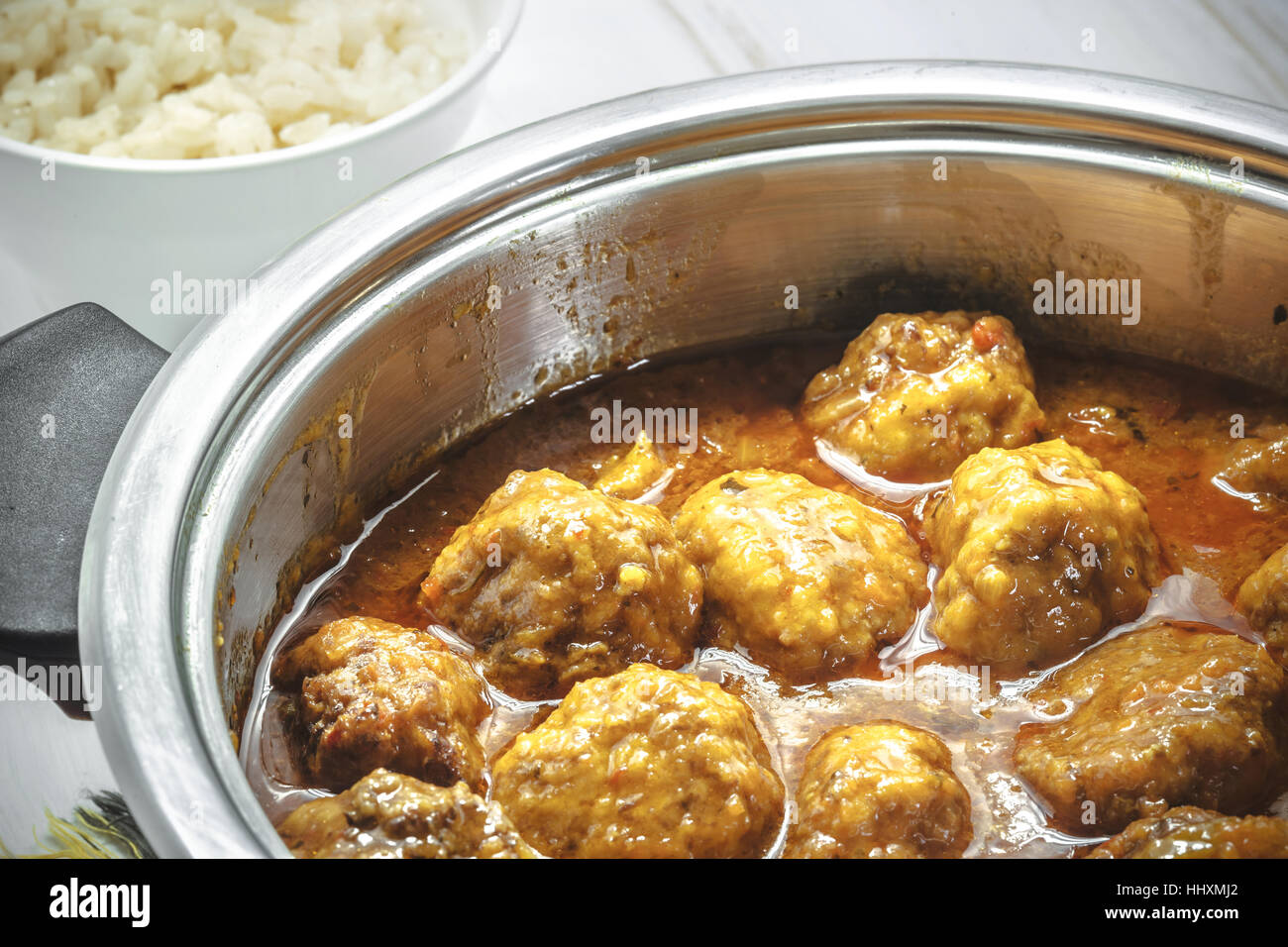 Homemade Meatballs in curry sauce and white rice Stock Photo Alamy