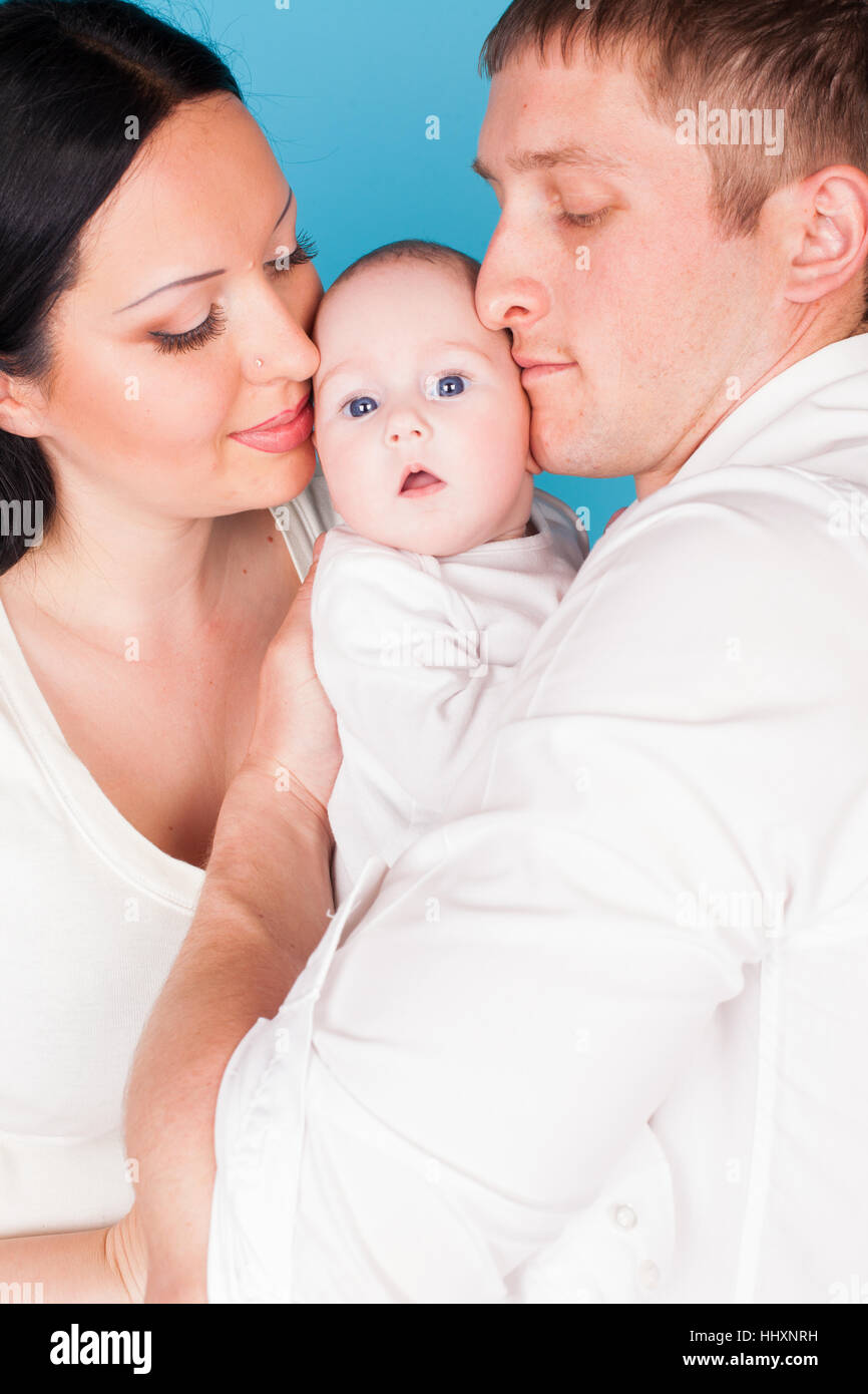 mom dad daughter little kid family Stock Photo