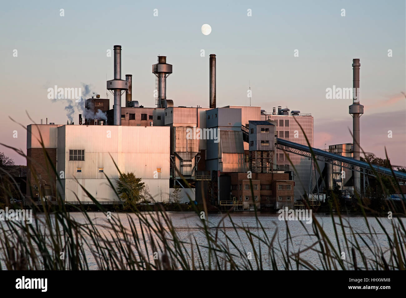 Steam power plant at dusk with moon, Virginia, Minnesota, USA Stock Photo