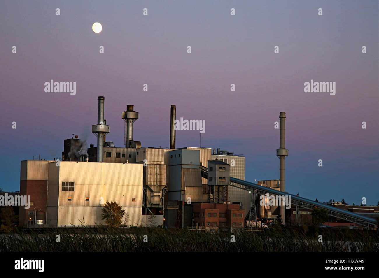 Steam power plant at dusk with moon, Virginia, Minnesota, USA Stock Photo