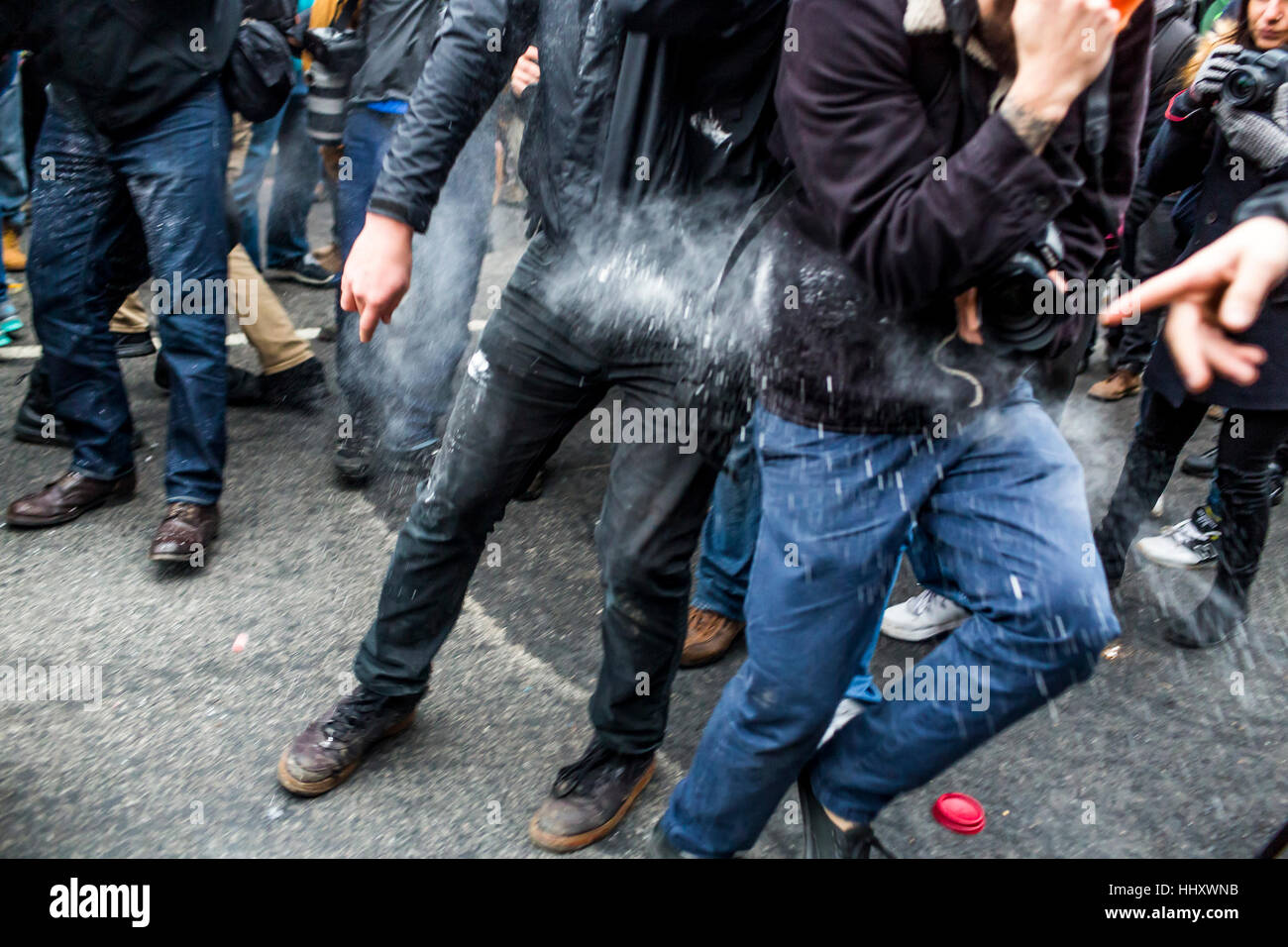 Washington, USA. 20th Jan, 2017. Hours after Donald Trump was inaugurated as the 45th President of the United States, protesters clashed with riot police, who reportedly were targeted the groins of protestors and launched flash grenades into the packed streets. Credit: PACIFIC PRESS/Alamy Live News Stock Photo
