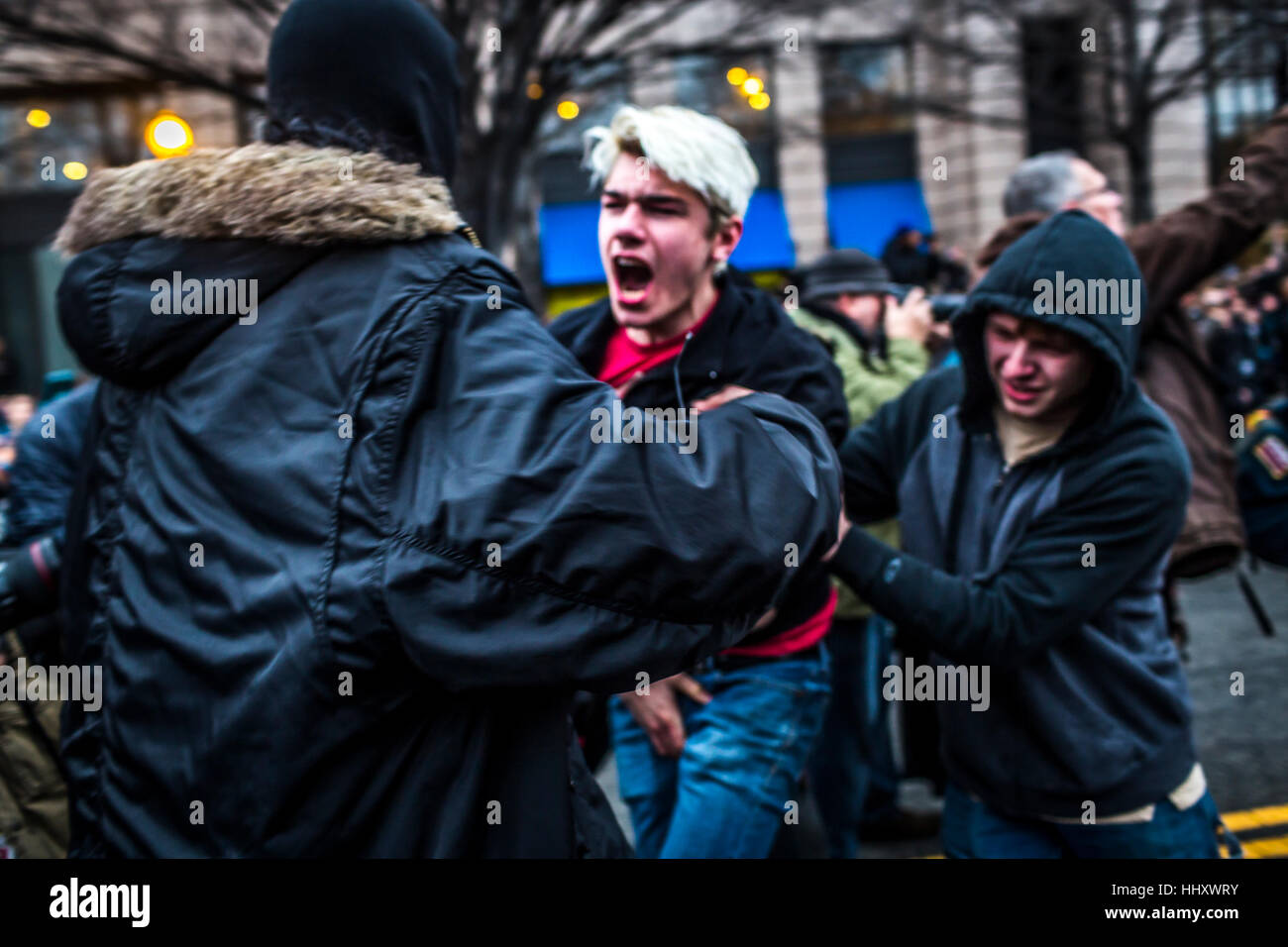 Washington, USA. 20th Jan, 2017. Hours after Donald Trump was inaugurated as the 45th President of the United States, protesters clashed with riot police, who reportedly were targeted the groins of protestors and launched flash grenades into the packed streets. Credit: PACIFIC PRESS/Alamy Live News Stock Photo