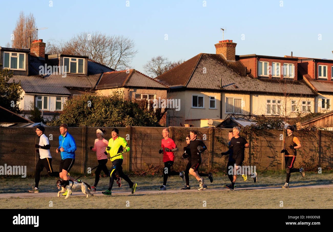 Runners take part in the Gunnersbury Park run as Britain woke up to a chilly weekend with widespread frost potentially causing dangerous driving conditions. Stock Photo