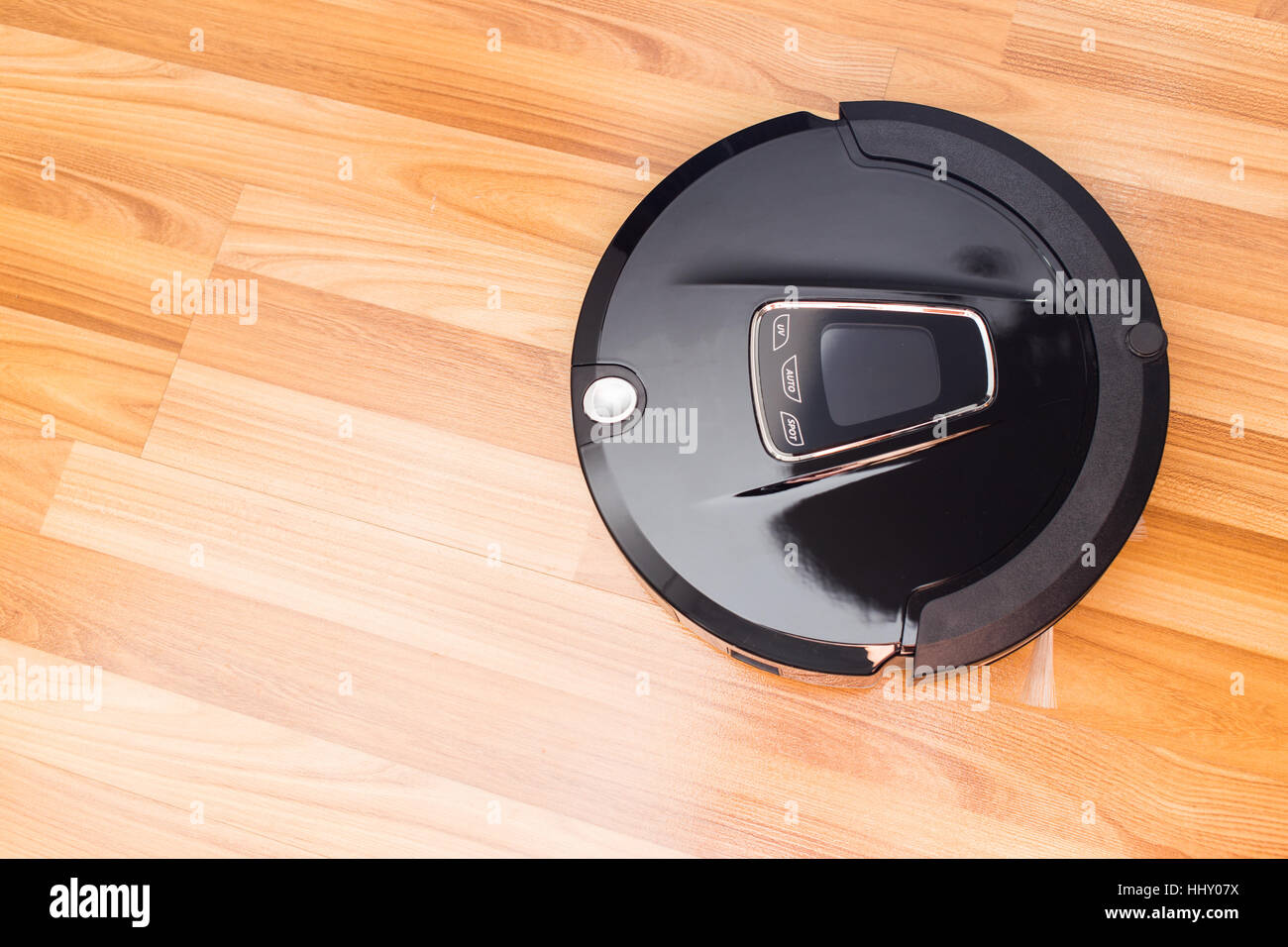 Robotic vacuum cleaner on wood parquet floor, Smart vacuum, new