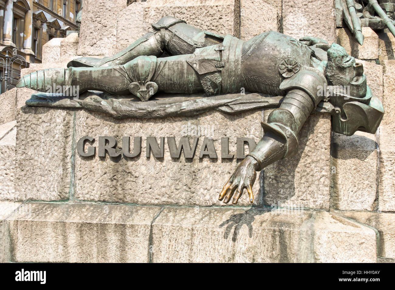 KRAKOW, POLAND - SEPTEMBER 5, 2013: A figure of a defeated knite on the monument dedicated to the battle of Grunwald  in Old town of Krakow. Stock Photo