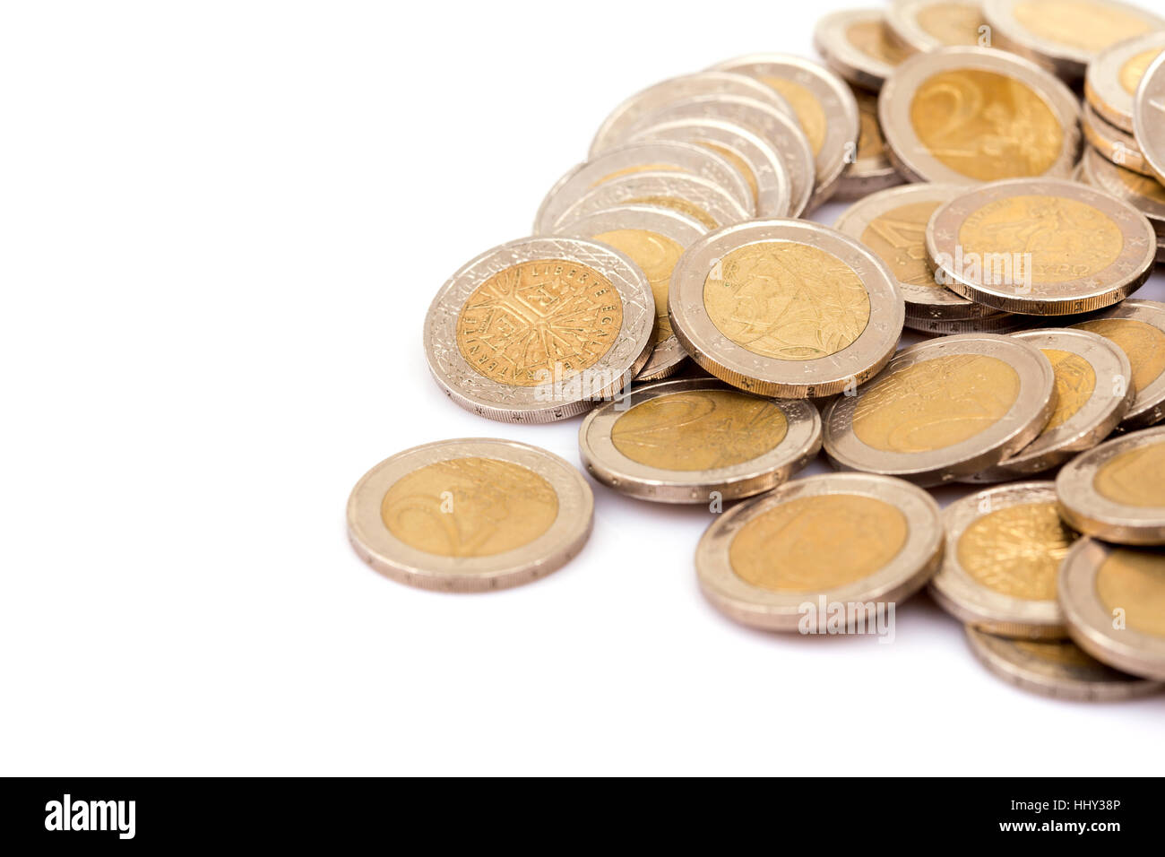Heap of two euro coins isolated on white background Stock Photo - Alamy