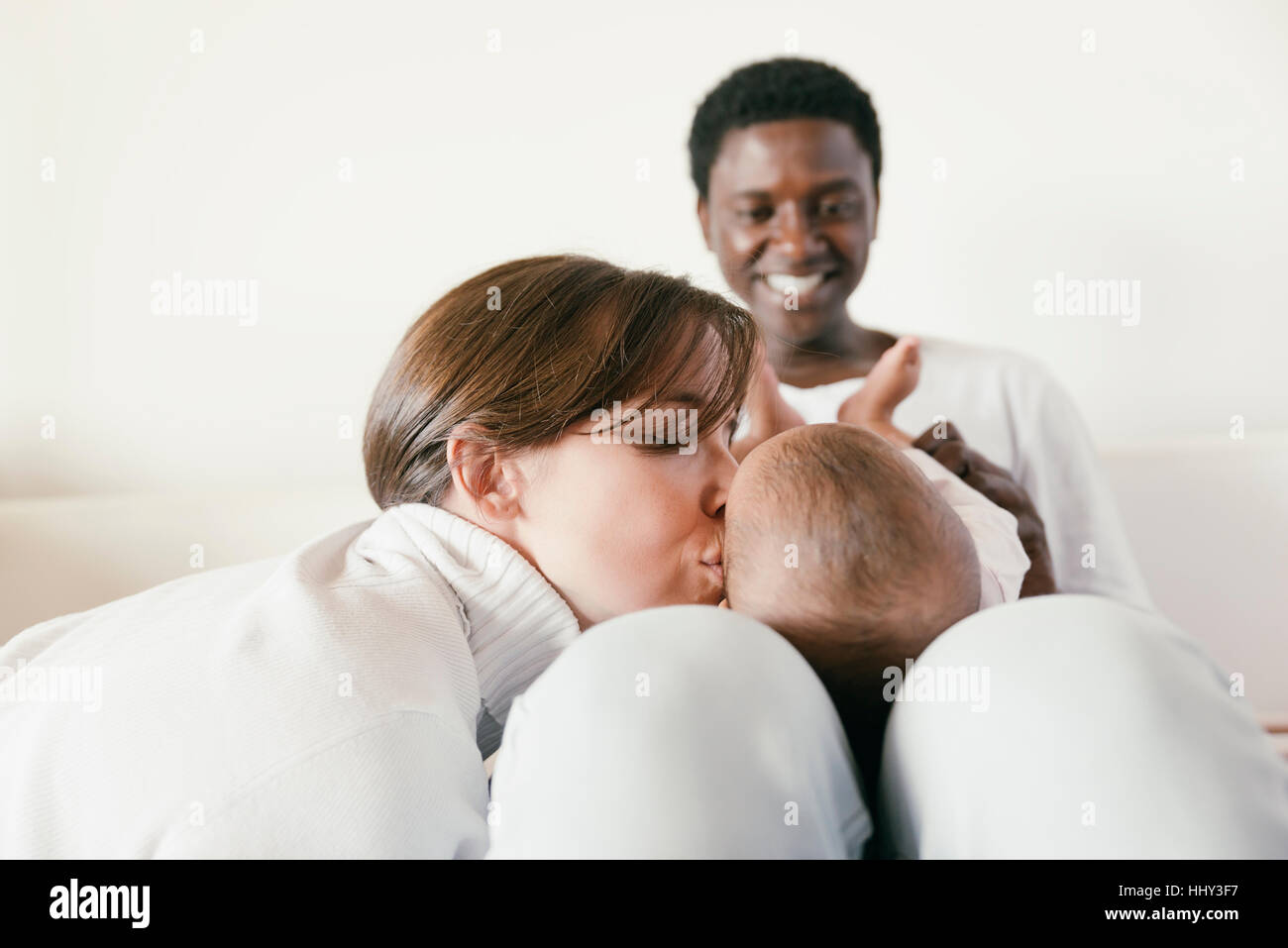 Happy Family, Mother, Father And Baby in home Stock Photo - Alamy