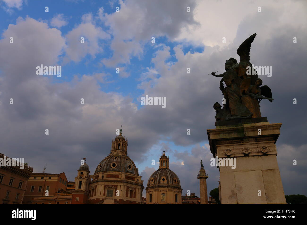 After the storm skyline of Rome with domes and statues in Rome, Italy ...