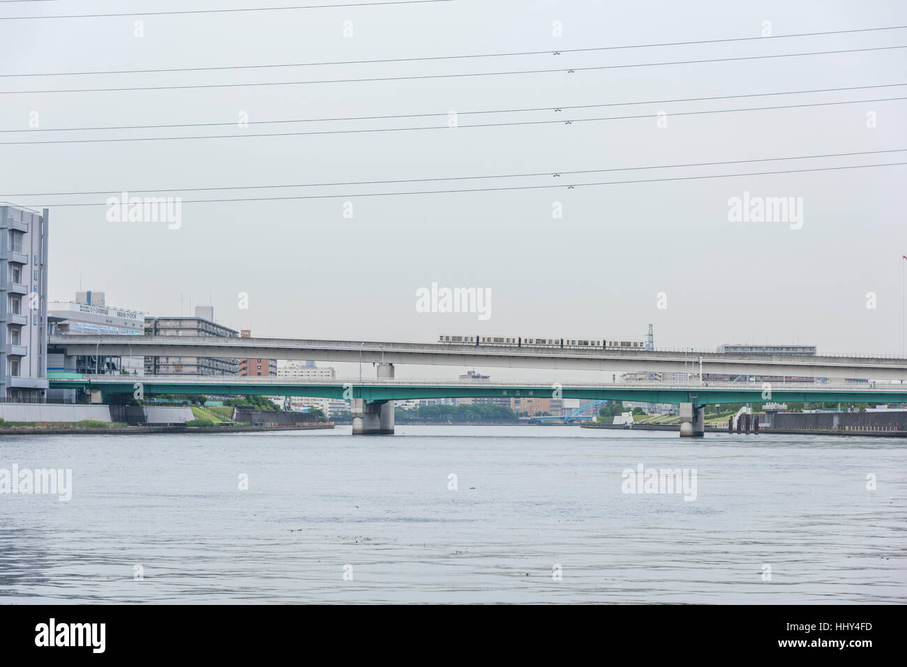 Nippori Toneri Liner and Ogu Bridge, Sumida River Bridge,Tokyo,Japan Stock Photo
