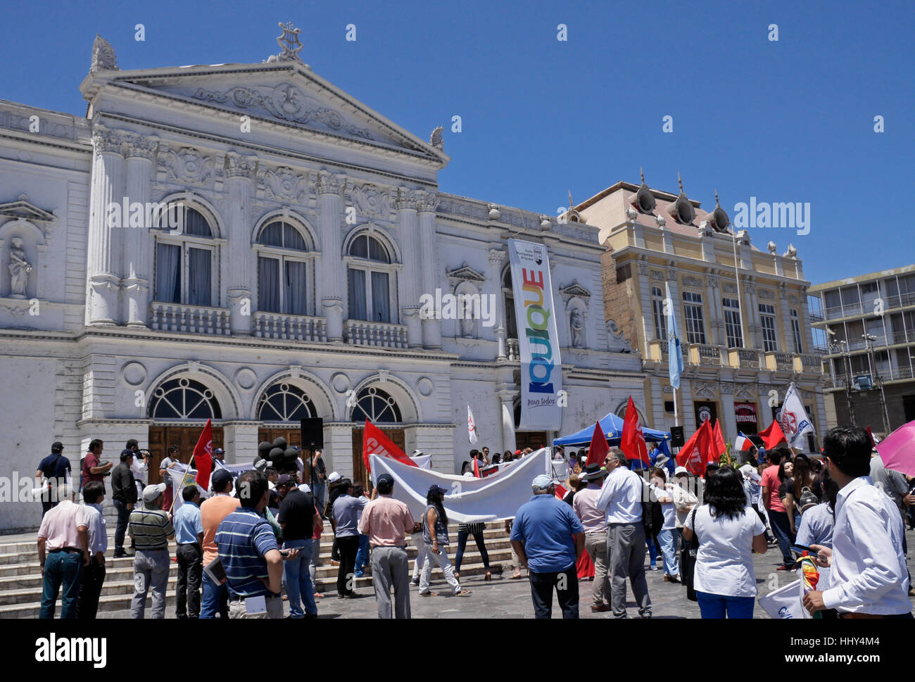 Demonstration in front of Teatro Municipal and Sociedad Protectora de Empleados de Tarapaca facing Plaza Prat, Iquique, Chile Stock Photo
