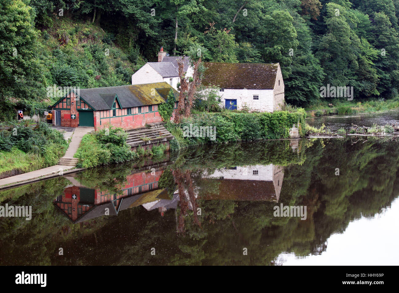 View from Prebends Bridge of Durham School Boat Club house and the Old Mill house reflected in the River Wear, Durham, England. Stock Photo