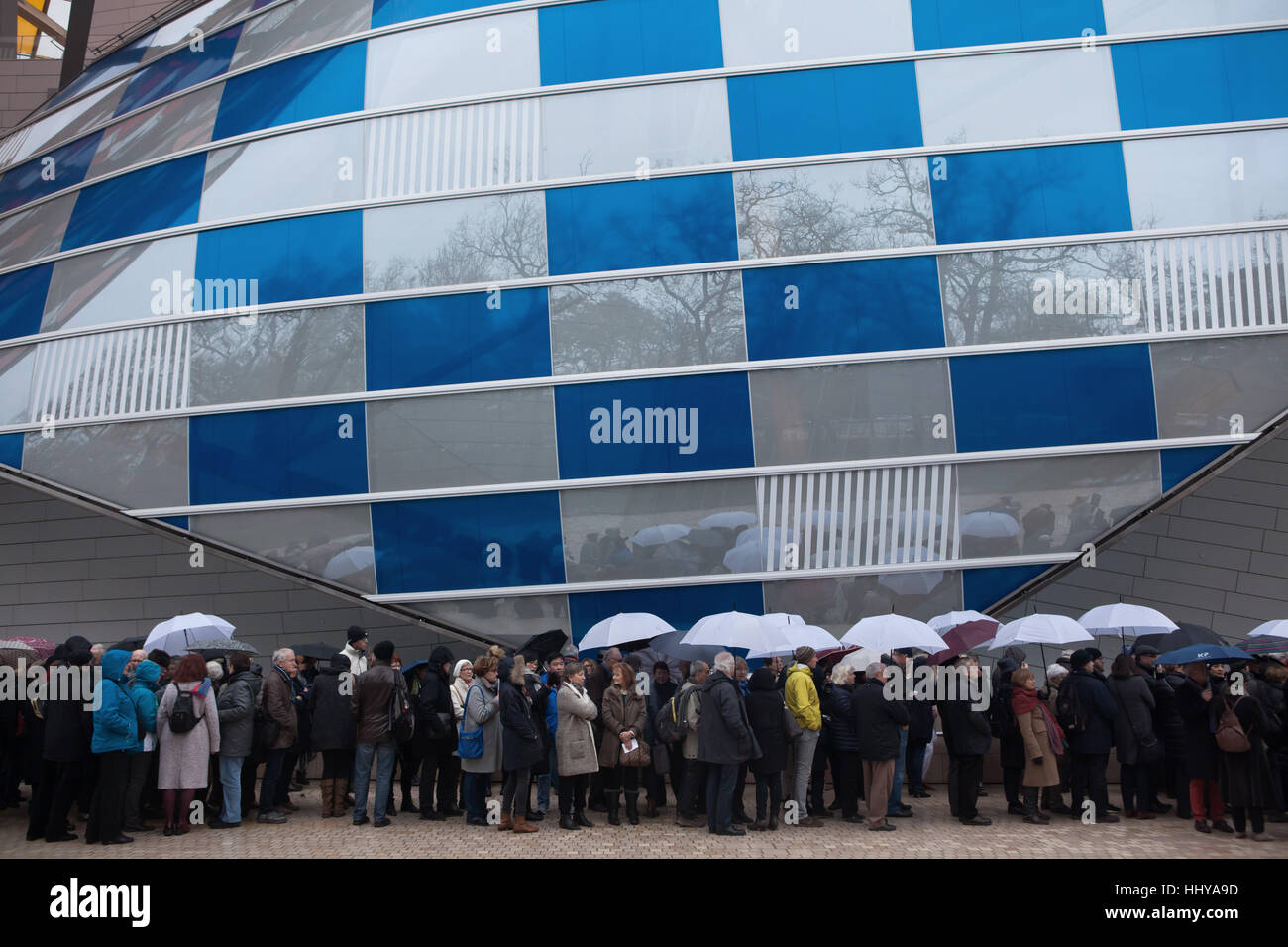 Queue of visitors to the Fondation Louis Vuitton in the Bois de Boulogne in  Paris, France. People wait for the security control to visit the exhibition  Icons of Modern Art from the
