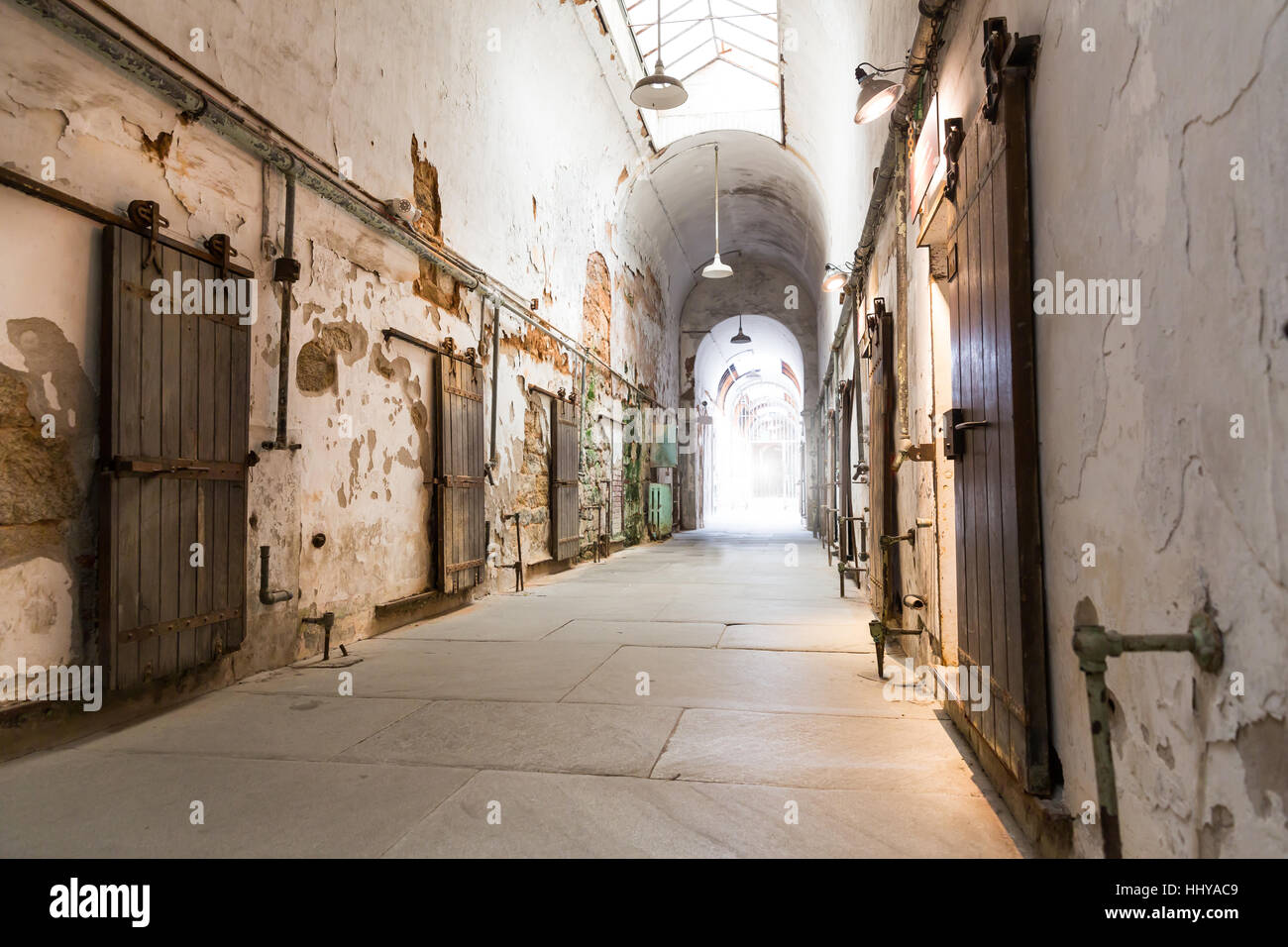 Jail hallway with locked doors. Stock Photo