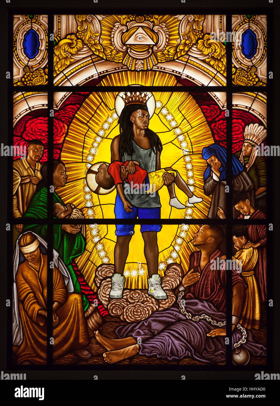 Stained-glass window entitled Mary, Comforter of the Afflicted I (2016) by African-American contemporary painter Kehinde Wiley displayed at his exhibition in the Petit Palais in Paris, France. The exhibition runs till 15 January 2017. Stock Photo