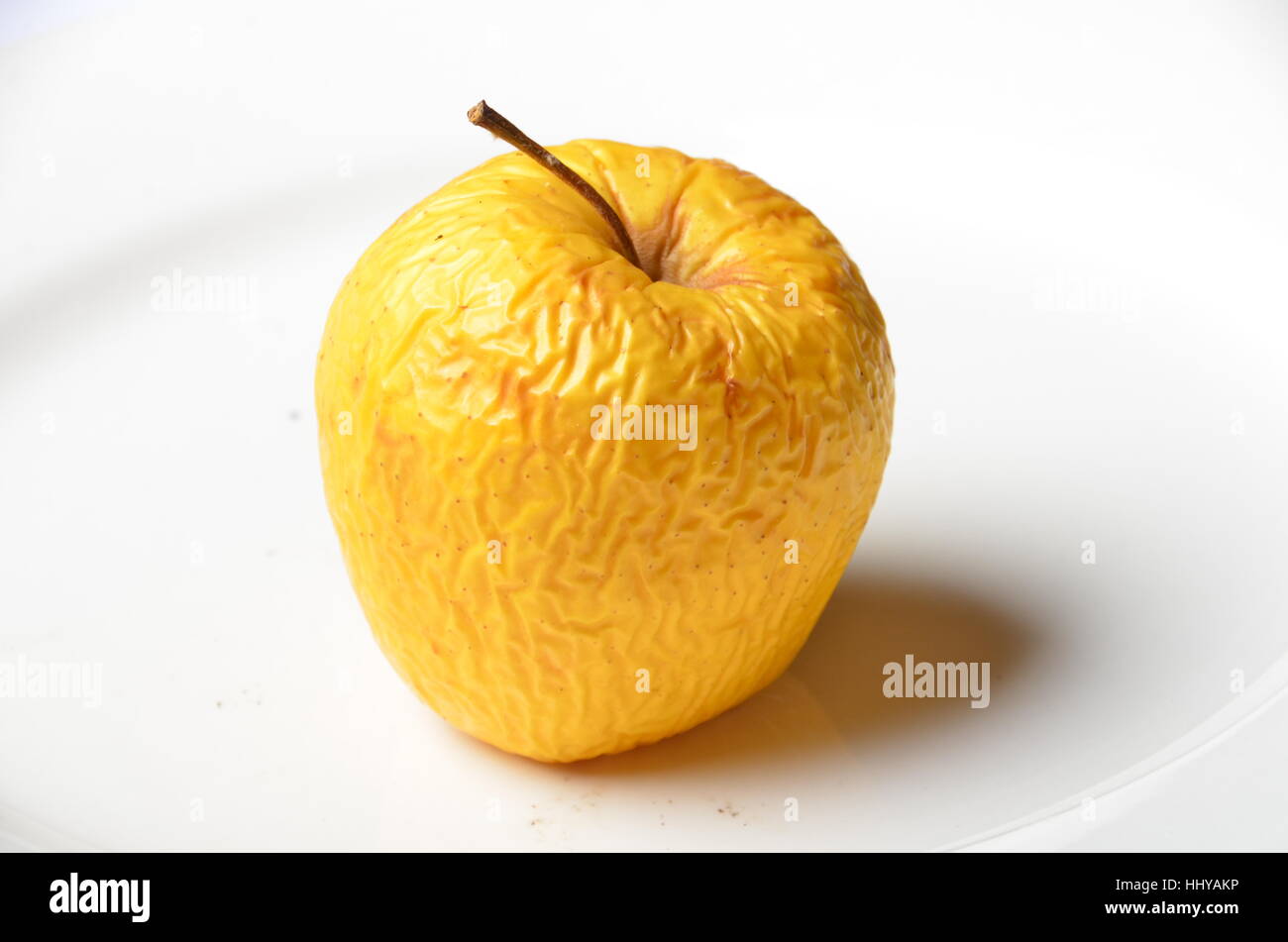 rotten old yellow apple Stock Photo