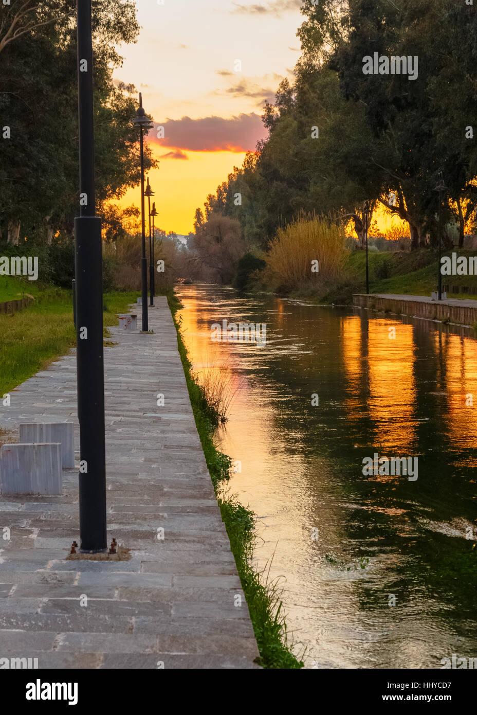 River reflections against a setting sun in the afternoon in Greece Stock Photo
