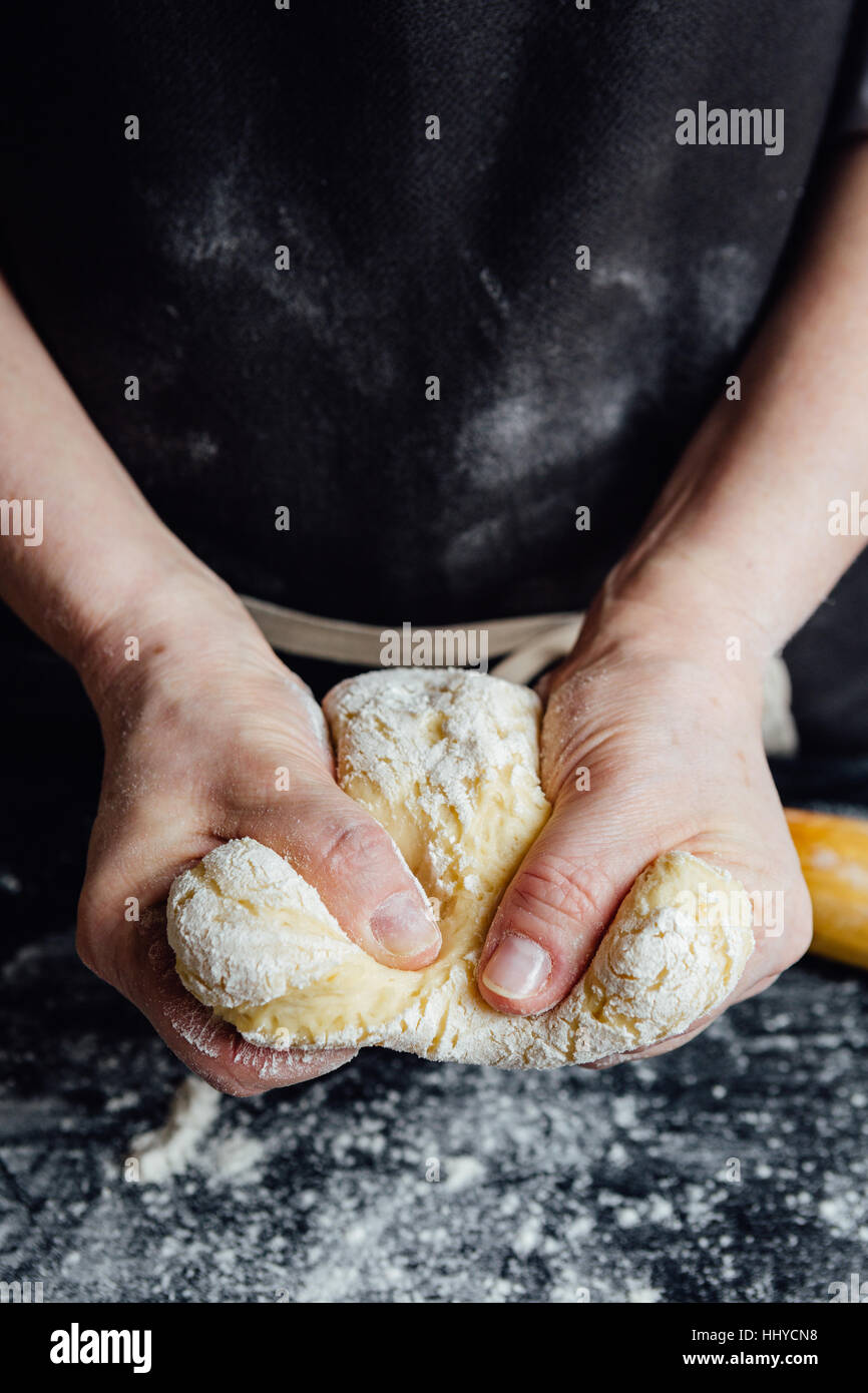 Cook beating up cookie dough Stock Photo - Alamy