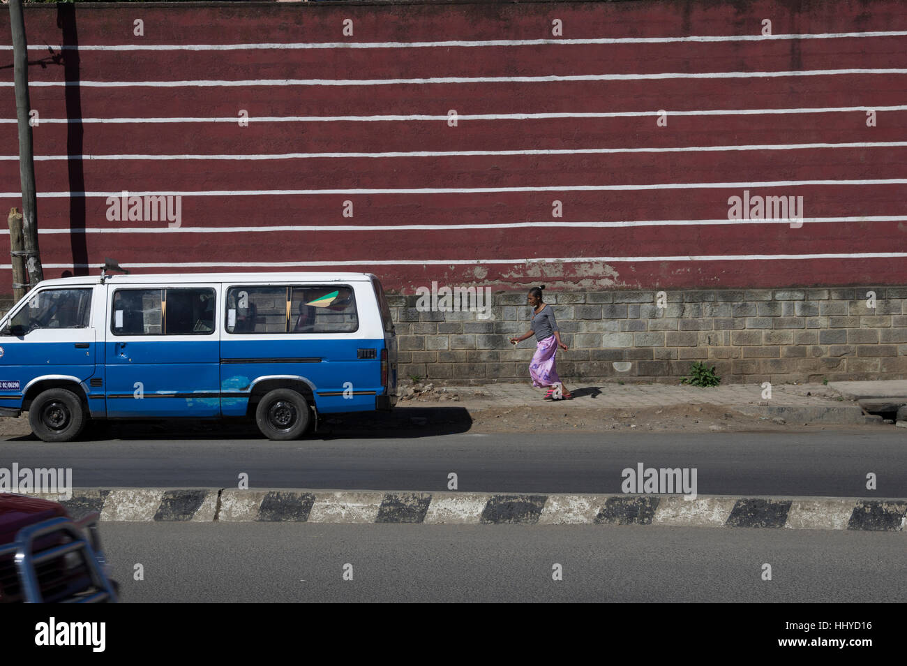white van with blue stripe