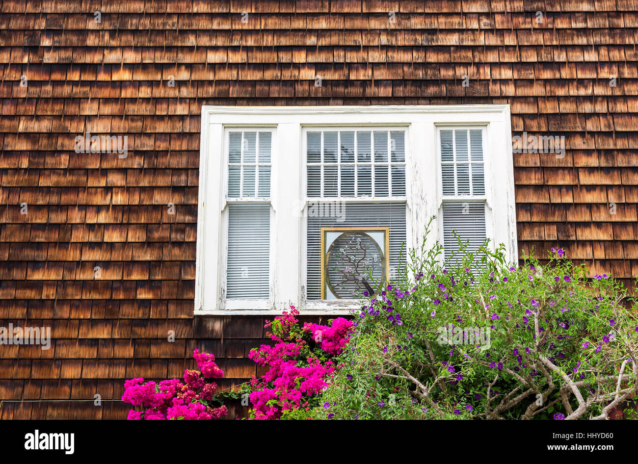 House with wooden window and flowers Stock Photo - Alamy