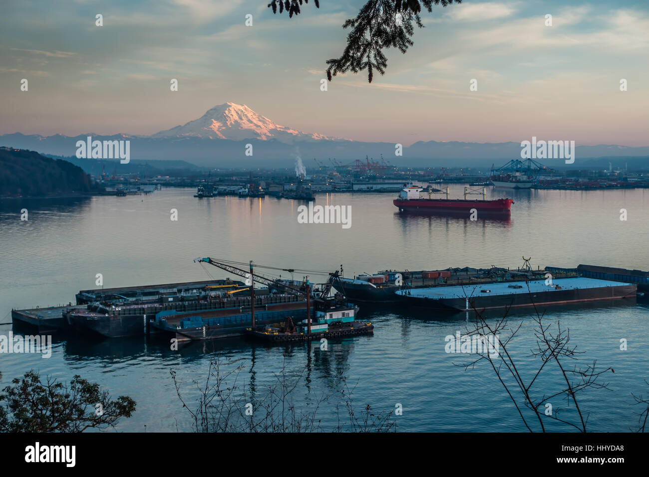 A view of the Port of Tacoma and Mount Rainier at sunset Stock Photo ...