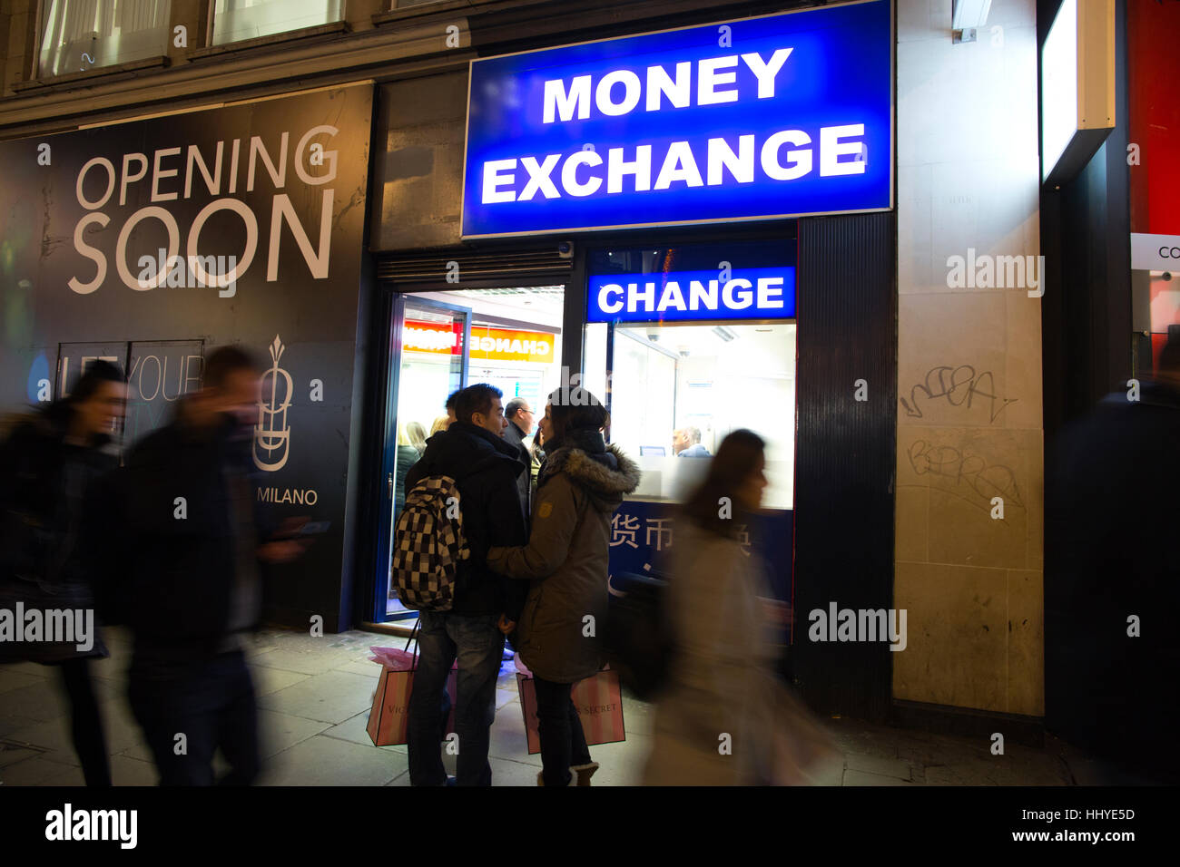 Money Exchange bureau late at night on Oxford Street, central London, England, UK Stock Photo