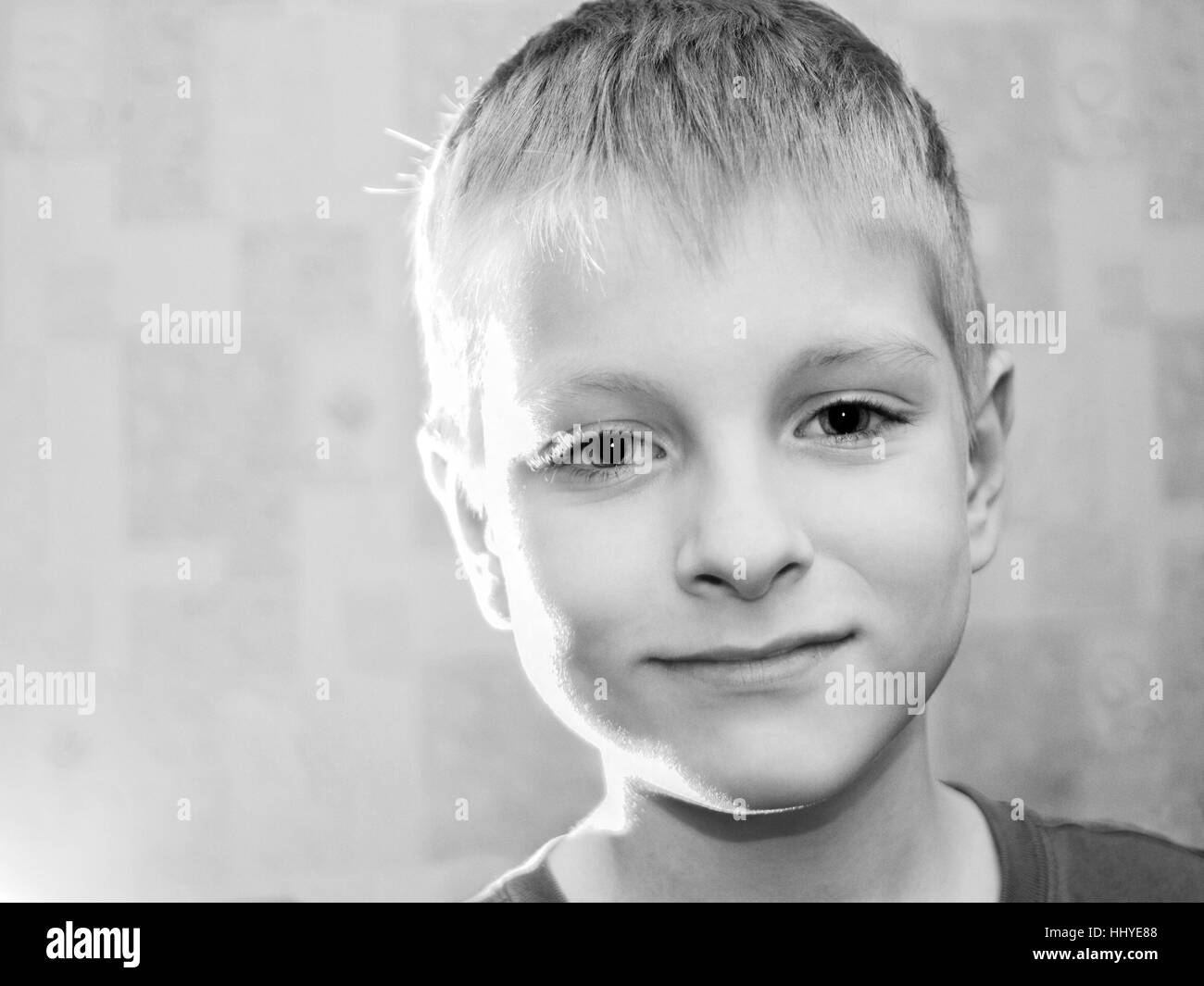 Portrait Caucasian boy looking to camera. Black and white Stock Photo