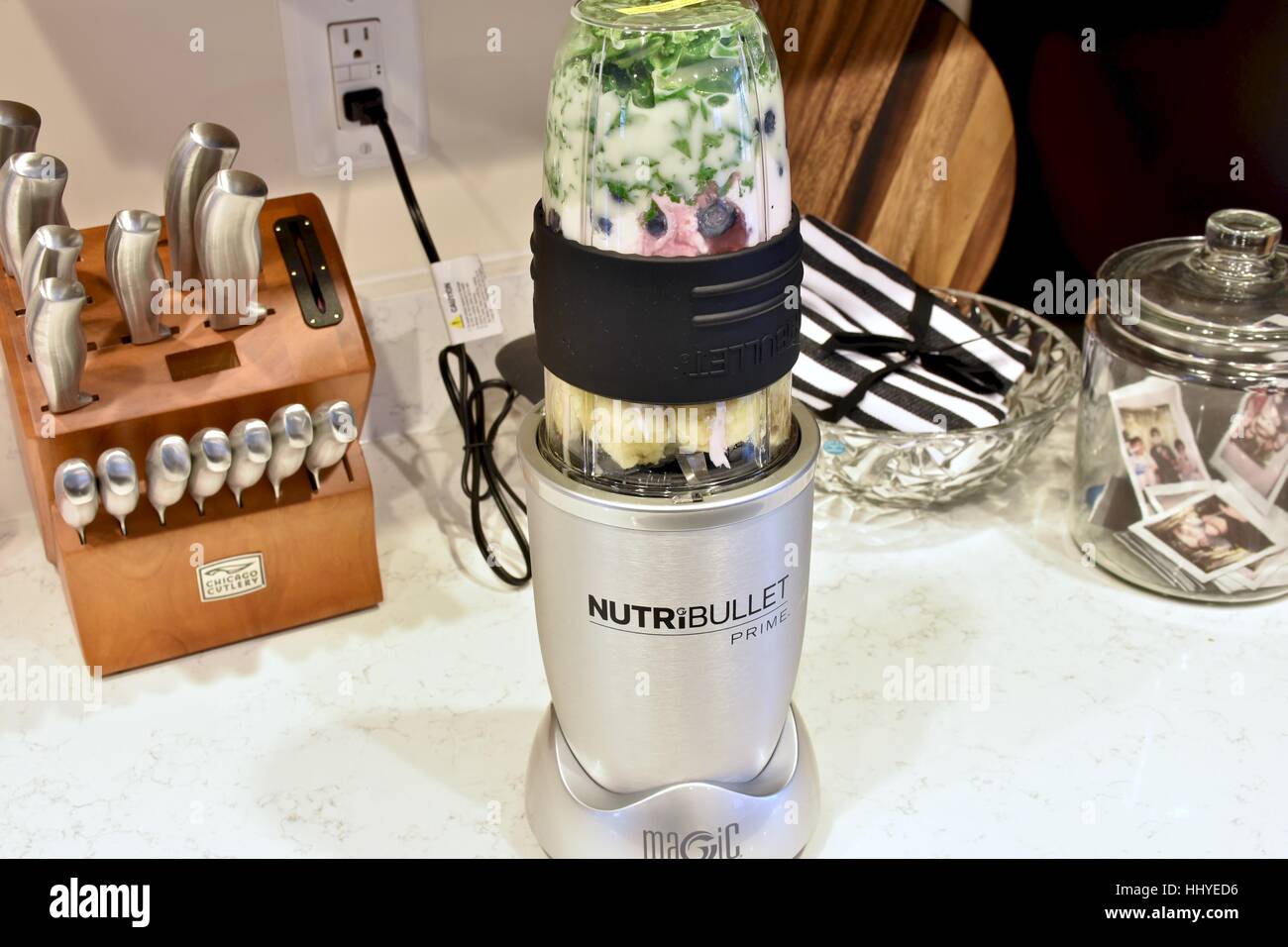 Making a smoothie with the NutriBullet blender in a modern kitchen Stock Photo Alamy