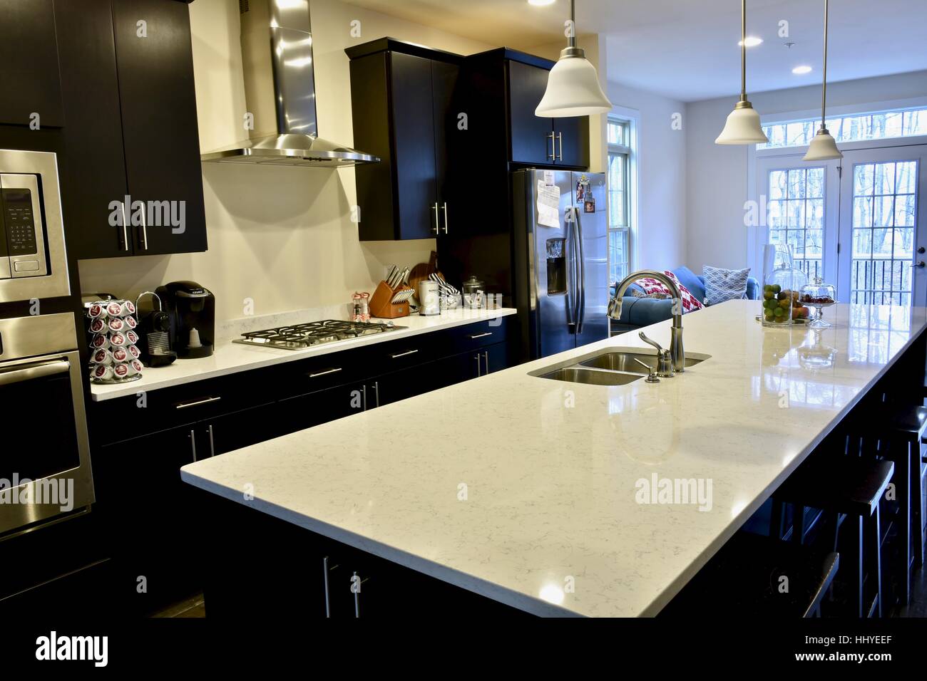 A beautiful kitchen with a large carrera marble island in a modern home  Stock Photo - Alamy