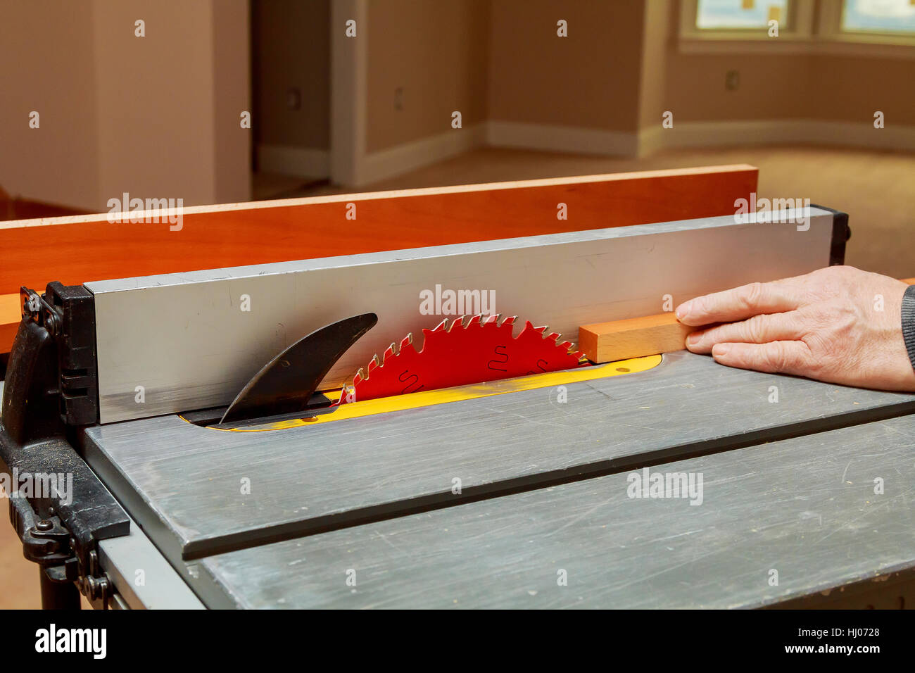 carpenter use ruler to measuring wood board Circular saw cutting wooden ...