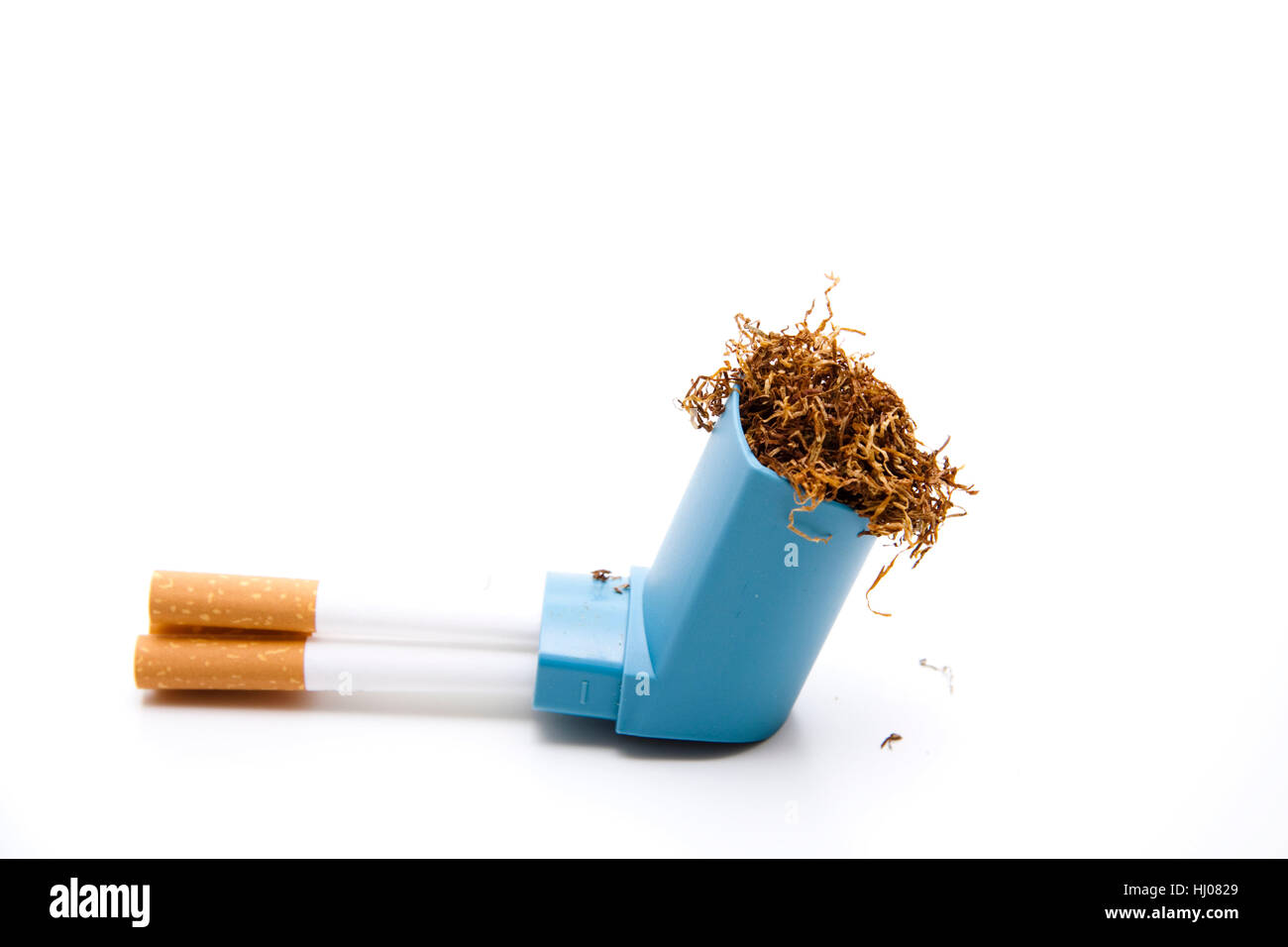 tobacco sleeves filling tobacco with sleeves Stock Photo