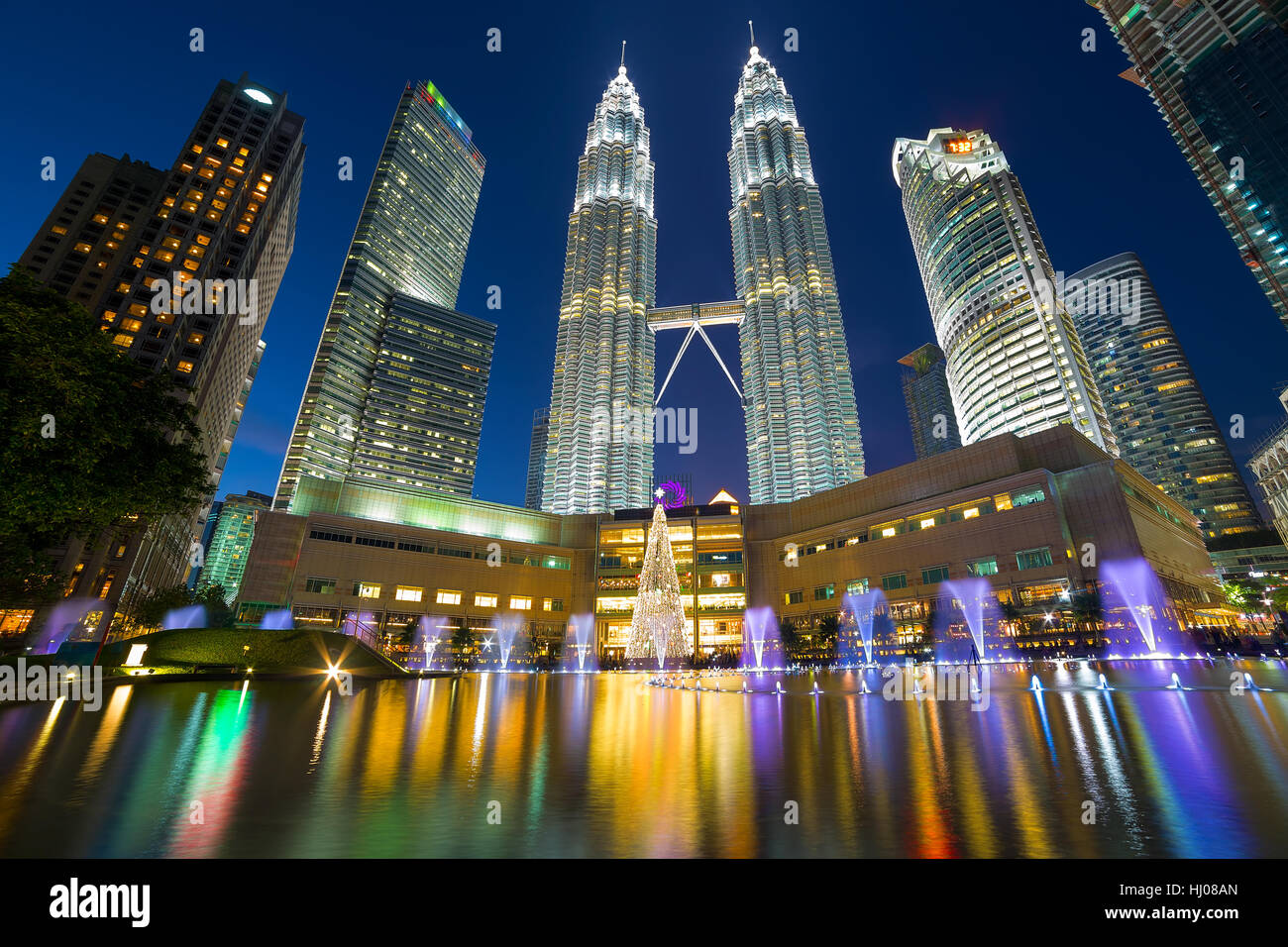 Kuala Lumpur Malaysia modern city skyline at KLCC Park by Symphony Lake at Night Stock Photo
