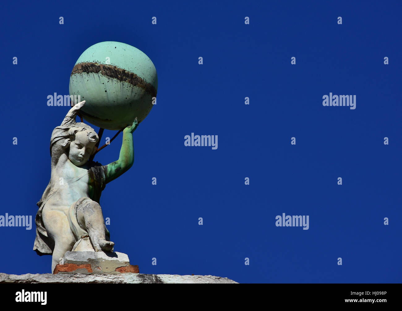 Little Atlas old statue holding up the globe in Venice (with copy space) Stock Photo