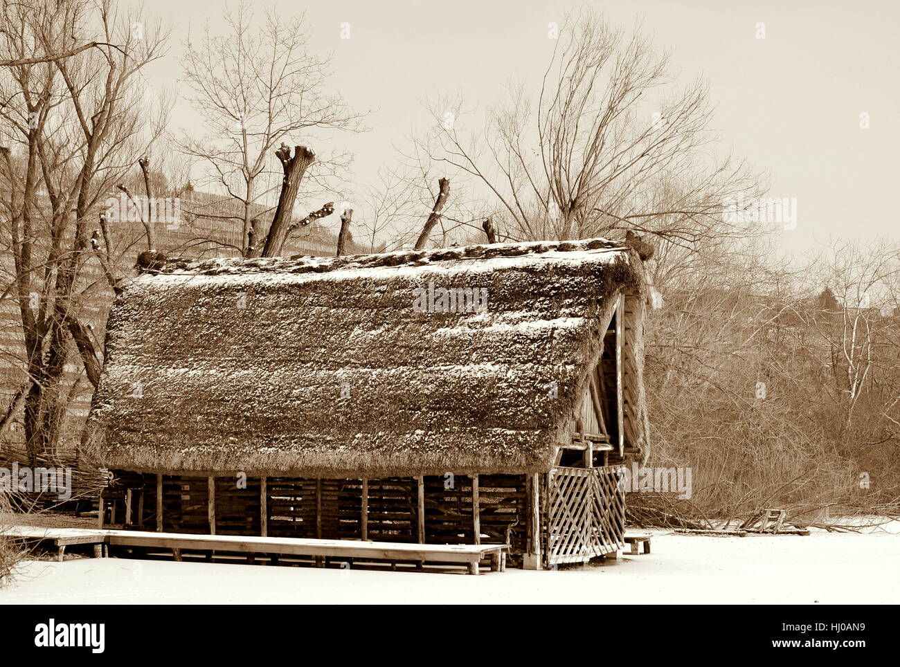 boathouse in winter on frozen lake Stock Photo