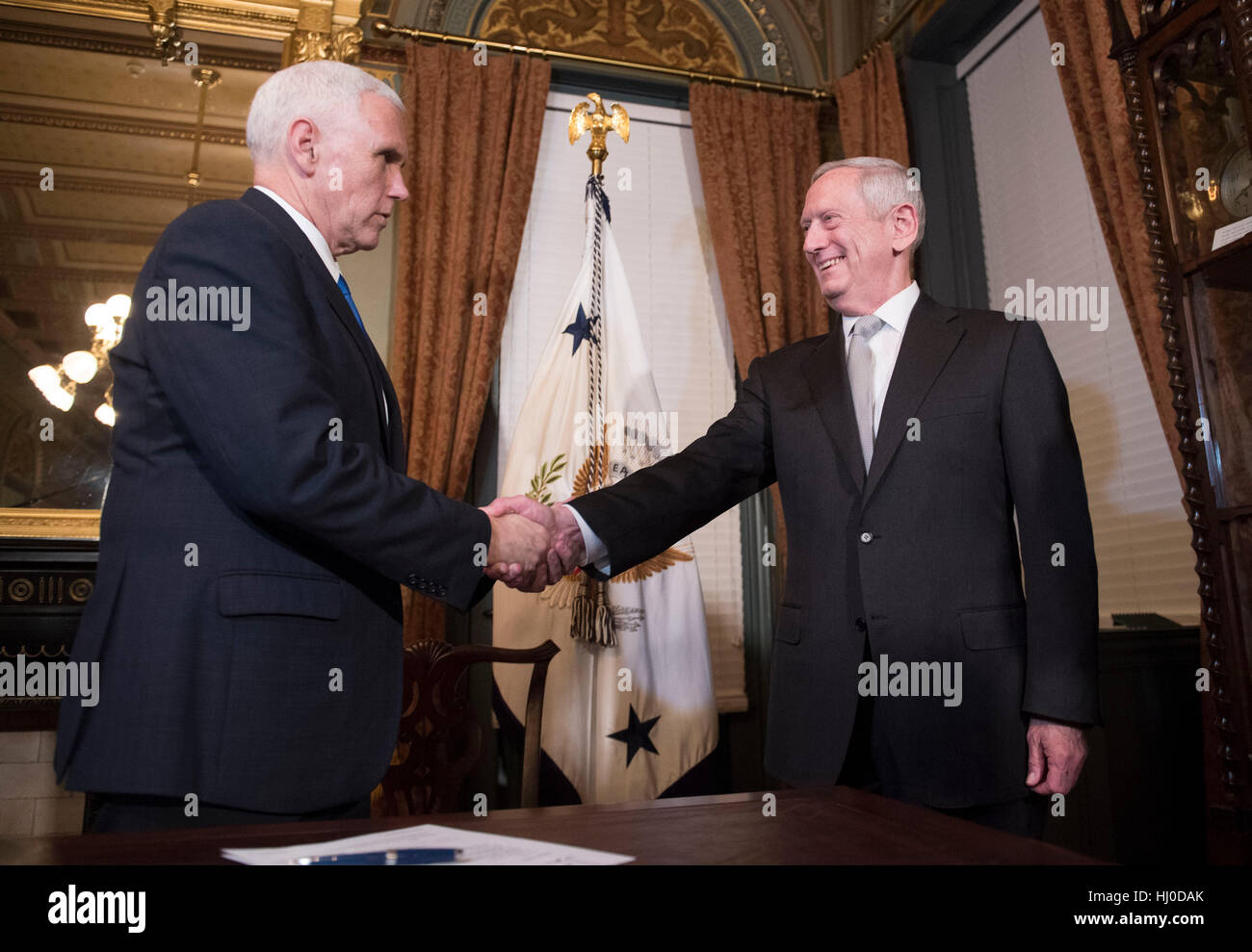 Washington, USA. 20th January, 2017. Marine Corps General James Mattis shakes hands with Vice President Mike Pence after being sworn-in as Defense Secretary, in the Vice Presidential ceremonial office in the Executive Office Building in Washington, DC on January 20, 2017. Photo by Kevin Dietsch/UPI /CNP/MediaPunch Credit: MediaPunch Inc/Alamy Live News Stock Photo