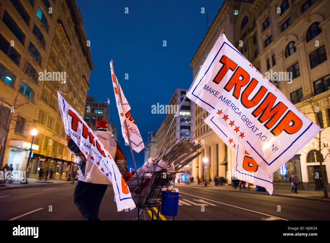 Vendor selling flags on a streets of Washington DC with Donal Trump Make America Great Agin signs. Stock Photo