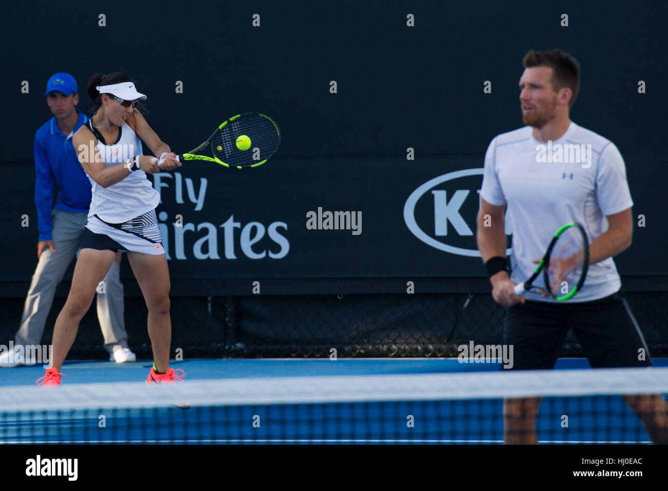 Melbourne, Australia. 21st Jan, 2017. Zheng Saisai (L) of China and Alexander Peya of Austria compete during the mixed doubles first round match against Sally Peers and her brother John Peers of Australia at the Australian Open Tennis Championships in Melbourne, Australia, Jan. 21, 2017. Zheng Saisai and Alexander Peya won 2-0. Credit: Bai Xue/Xinhua/Alamy Live News Stock Photo